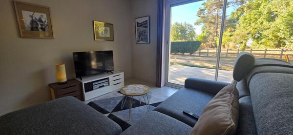 Maison de plain pied récente avec 2 chambres, garage et terrain de 1000 m2