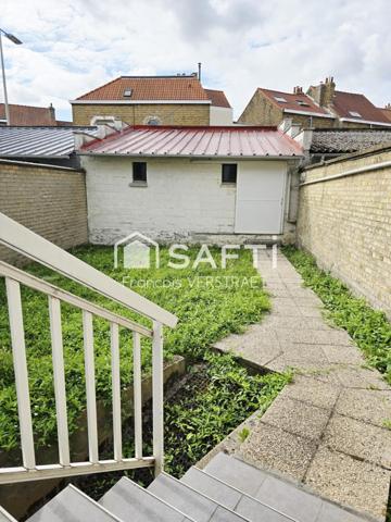 Maison 5 chambres , un jardin plein sud, double garage motorisé,grande  cave