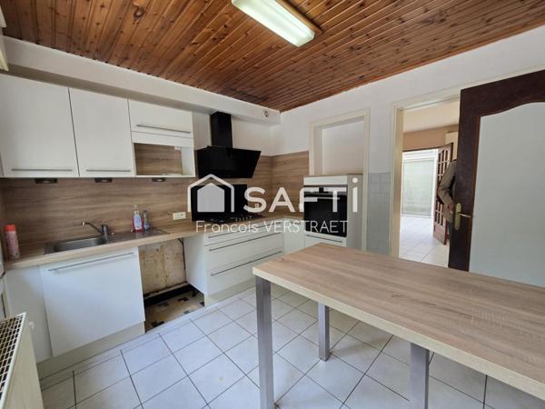 Maison 5 chambres , un jardin plein sud, double garage motorisé,grande  cave