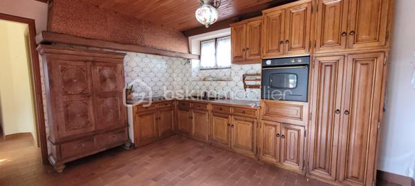 Dans un charmant village à 20 km de Chartres et Auneau et quelques minutes de Sours, découvrez cette maison atypique et familiale de 114 m², habitable de plain-pied et édifiée dans une ancienne chapelle.
 - ATTENTION : La partie arrondie est restée consacrée et ne fait partie du bien en vente -

Dès que vous franchirez le portail, vous serez séduit par le côté intimiste du jardin qui est clos de murs, arboré et sans vis à vis.
L'entrée dessert une pièce de vie de 27 m² avec cheminée et une cuisine lumineuse de 13,5 m². Ces 2 pièces donnent accès à la terrasse par de grandes portes-fenêtres. Le RdC dispose également de 2 chambres ( 11 m² et 9 m²), une salle d'eau-WC et une buanderie. 
A l'étage, une charmante pièce palière dessert 2 chambres (9 m² et 12,5 m²) ainsi qu'un petit grenier aménageable.

Chauffage radiateurs tubulaires avec chaudière électrique. Cheminée à foyer ouvert avec bouches de chaleurs à l'étage.
Huisseries : châssis bois simple vitrage, avec survitrage et double-vitrage.
Assainissement non collectif non conforme mais opérationnel (bac de dégraissage et fosse septique avec épandage).

+ Les PLUS + :
  - Dépendance de 56m² et 5 m de haut pour stockage, garage et aménageable ;
  - Jardin sans aucun vis-à-vis et environnement calme ;
  - Petite cave voûtée ;
  - Portail électrique ;
  - Alarme dont el contrat peut être transféré ;
  - Raccordé fibre.

Travaux à prévoir :
  - Une partie de la couverture donnant sur la rue à changer avec lucarnes à remplacer ;
  - Revêtement muraux et sols à rafraichir en grande partie
  - Cuisine et salle d'eau à rénover 
  - Une partie de l'électricité à remettre aux normes

Pour améliorer la performance énergétique :
  - Une grande partie des fenêtres et des volets à changer ;
  - Isolation des murs ;
  - Isolation de la toiture ;
  - Pose d'une pompe à chaleur air-eau et ballon thermodynamique ;
  - Pose dune VMC double-flux.

Taxe foncière 2026 : 744 €

Si cette maison à fort potentiel correspond à vos attentes, appelez-moi !
  .