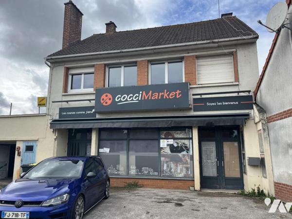 IMMEUBLE DE COMMERCE ET HABITATION, appartement occupé, local en RDC LIBRE