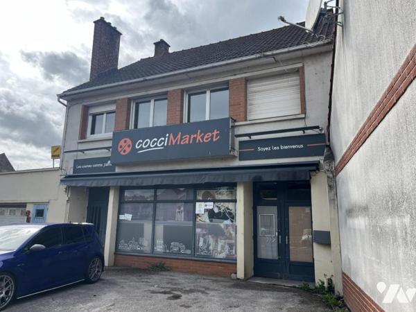 IMMEUBLE DE COMMERCE ET HABITATION, appartement occupé, local en RDC LIBRE