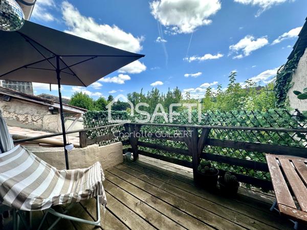 Maison de ville avec terrasse et local commercial