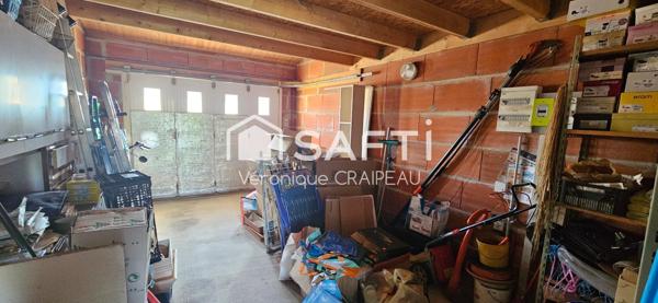 Maison de plain pied proche clinique avec 3 chambres, garage et abri-terrasse.