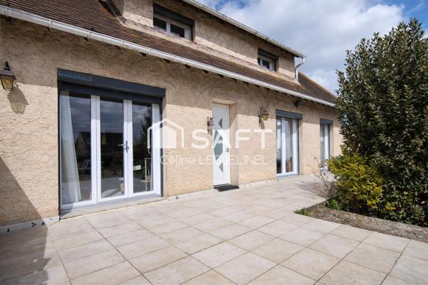 Maison familiale avec jardin, sous-sol total et beaux volumes
