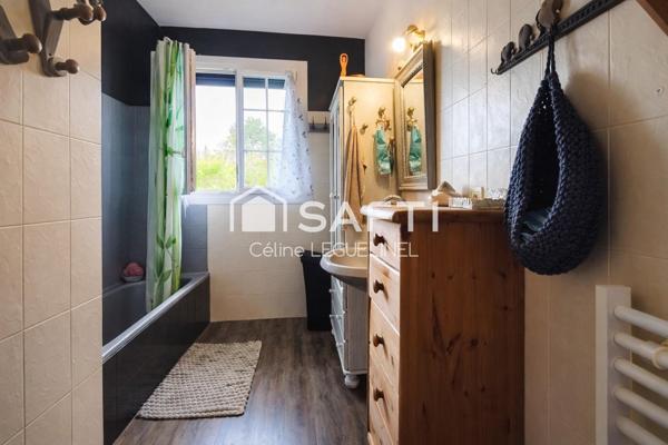 Maison familiale avec jardin, sous-sol total et beaux volumes