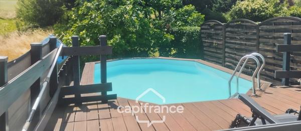 Maison familiale d'environ 100 m2 avec piscine, terrain arboré et grand garage au calme de la campagne ardéchoise