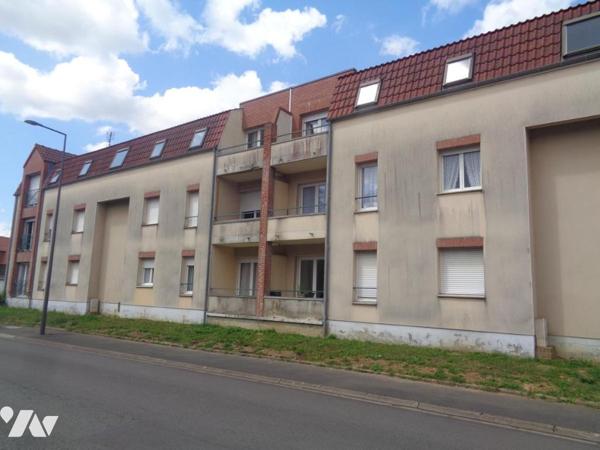 Ensemble immobilier composé de 4 appartements de type 3 et de 3 garages 