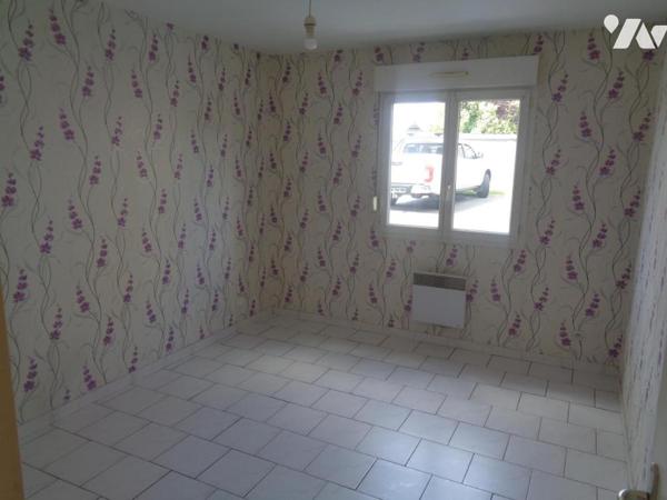 Ensemble immobilier composé de 4 appartements de type 3 et de 3 garages 