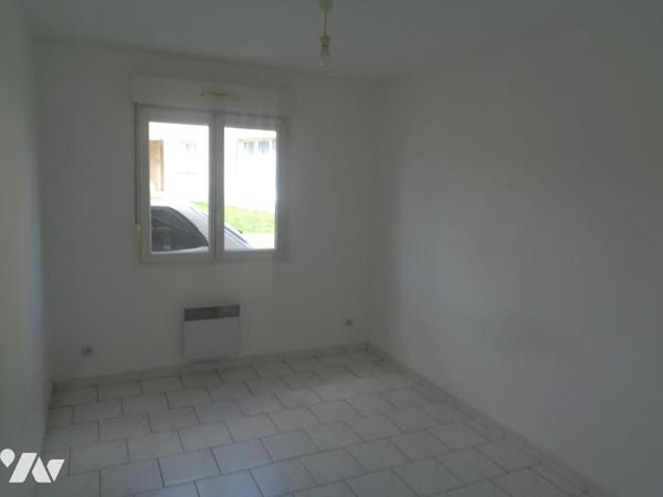 Ensemble immobilier composé de 4 appartements de type 3 et de 3 garages 