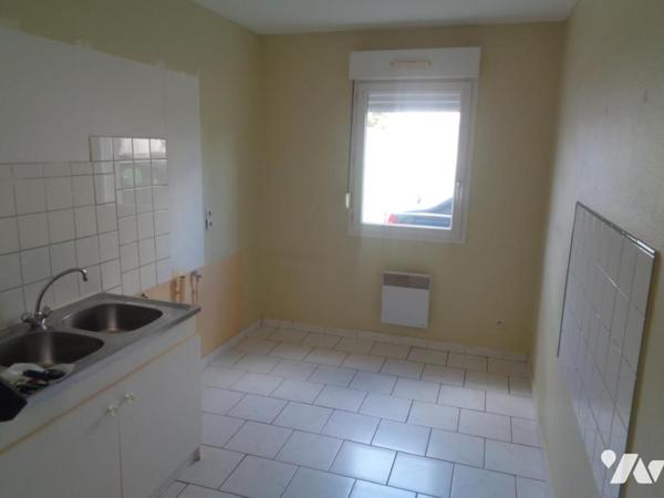 Ensemble immobilier composé de 4 appartements de type 3 et de 3 garages 