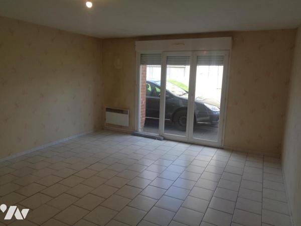 Ensemble immobilier composé de 4 appartements de type 3 et de 3 garages 