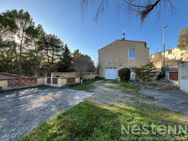 Carcassonne maison traditionnelle 129 m² 4 chambres terrain 1 100 m² sous-sol garages jardin arboré chauffage gaz