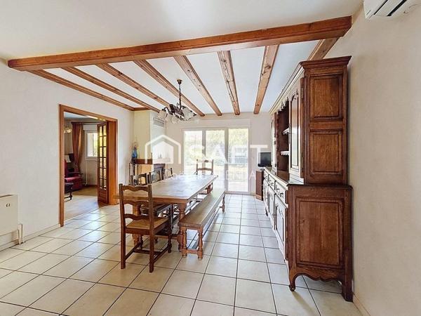 Maison individuelle avec jardin clôturé et garage