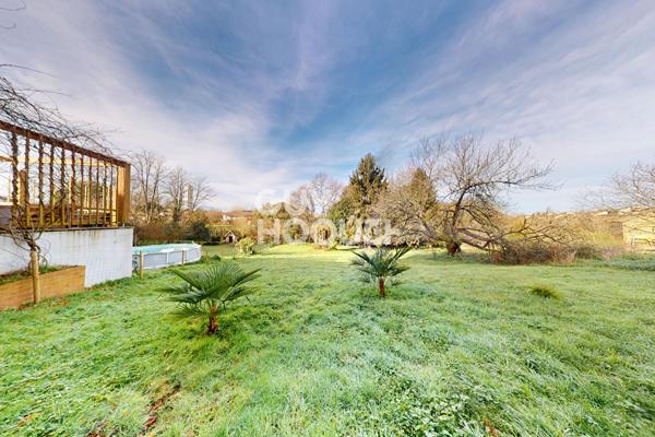 Ensemble immobilier avec appartement T2 + garage, local commercial et jardin à SAMADET