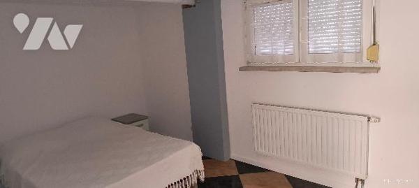 Maison de 103 m2 sur 4,76 ares dans quartier résidentiel.