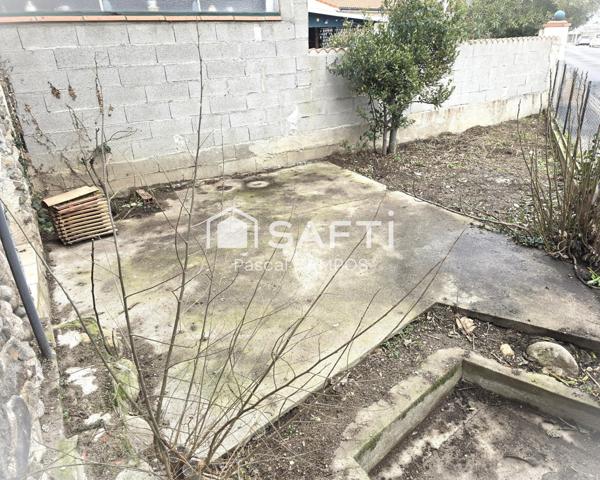 Maison de ville avec terrasse et petit jardin