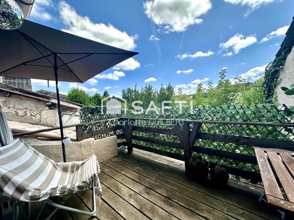 Maison de ville avec terrasse et local commercial