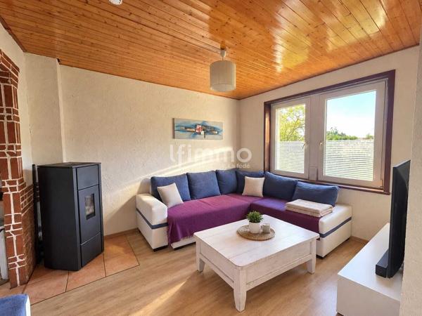Maison mitoyenne avec grand terrain de 800 m²