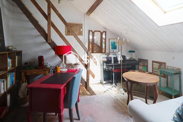 Maison mitoyenne avec 4 chambres, jardin et garage!