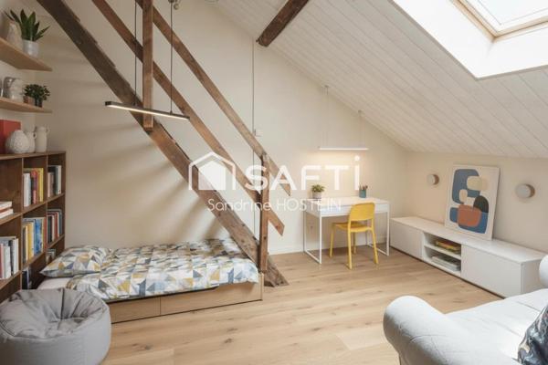 Maison mitoyenne avec 4 chambres, jardin et garage!