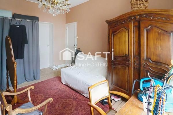 Maison mitoyenne avec 4 chambres, jardin et garage!