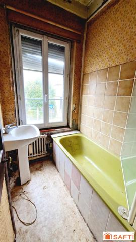 Maison de 117m2 avec jardinet à rénover au centre-ville