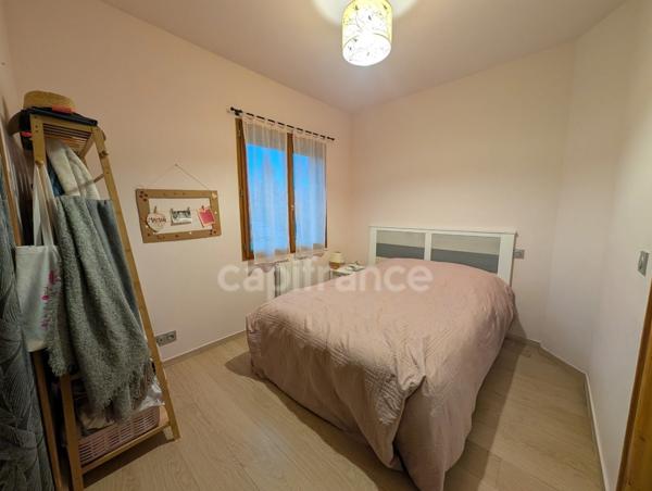 Appartement à vendre 3 pièces, places de parking privatives, cave et jardin