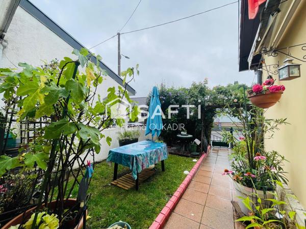 Spécial investisseur Maison mitoyenne d’un coté avec garage veranda jardin
