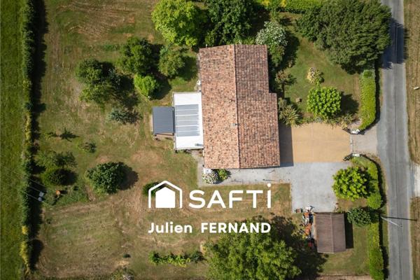 Maison plain-pied avec double garage, véranda et jardin