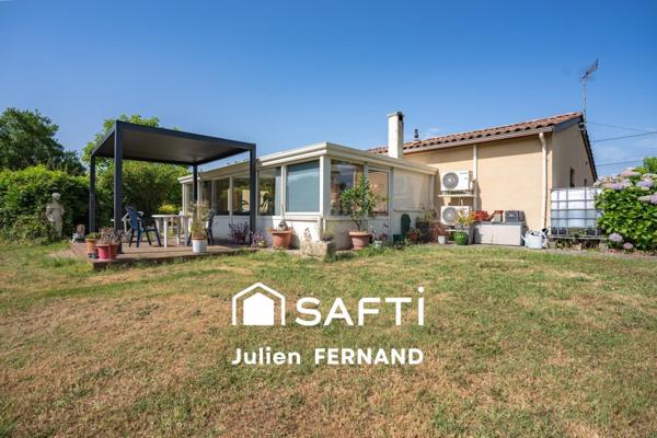 Maison plain-pied avec double garage, véranda et jardin