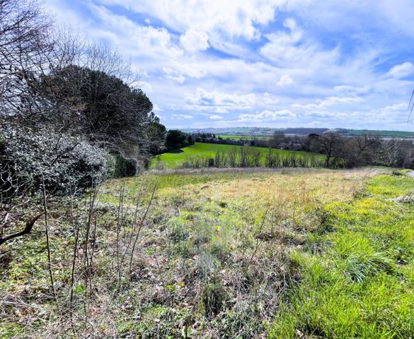 Magnifique terrain avec vue sur les coteaux