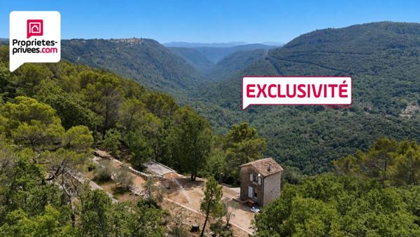 TOUR EN PIERRES AMENAGEE AVEC TERRAIN DE 7 HECTARES ET VUE PANORAMIQUE SUR LA VALLEE DE LA SIAGNE