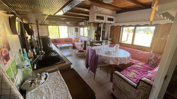 Mobil home avec assainissement, garage et jardin