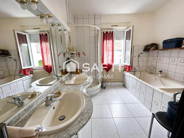 À vendre Mulhouse – Grande maison familiale avec jardin, garages et potentiel de division en 3 logements