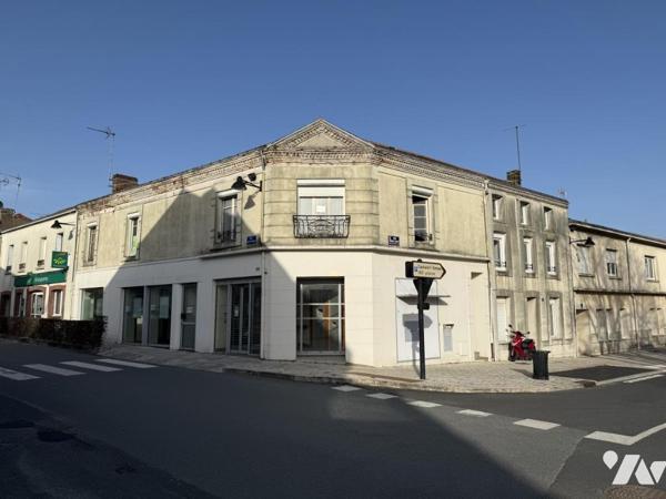 Immeuble à usage commercial et d’habitation à rénover 