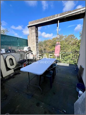 Appartement face aux remparts avec toit terrasse