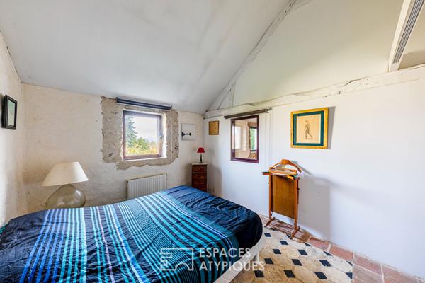 Harmonie entre ancien et contemporain : Corps de ferme réinventé en maison d’architecte avec patio à Mézières-sur-Seine