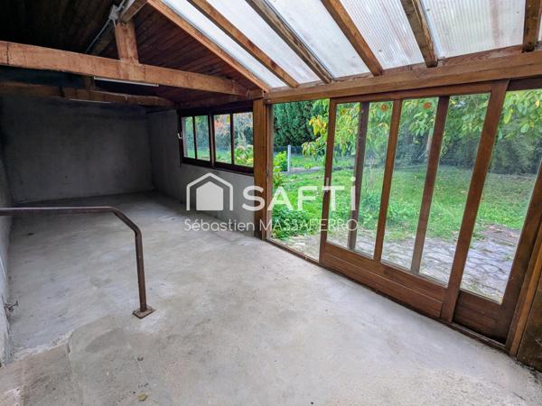 Maison de plain-pied avec jardin et véranda