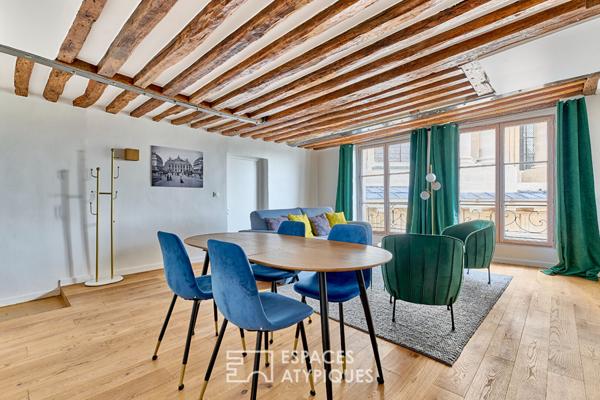 Appartement avec poutres apparentes et vue sur Saint-Eustache
