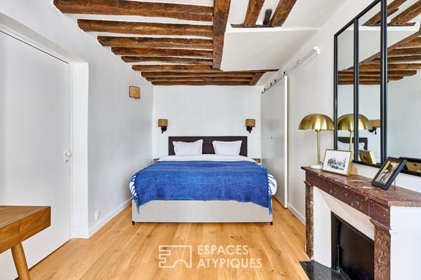 Appartement avec poutres apparentes et vue sur Saint-Eustache