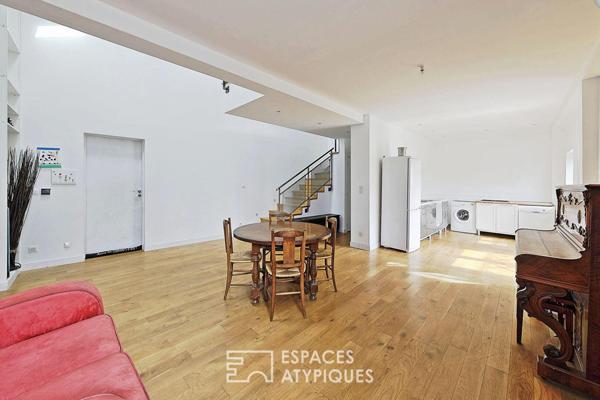 Esprit factory et volumes spectaculaires pour ce loft avec jardin privatif