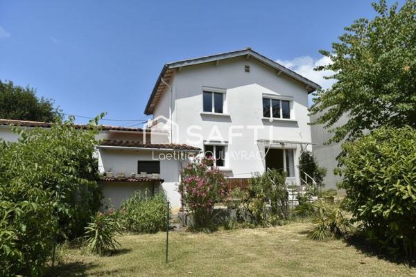 Maison 81 m² avec garage et jardin, proche centre.