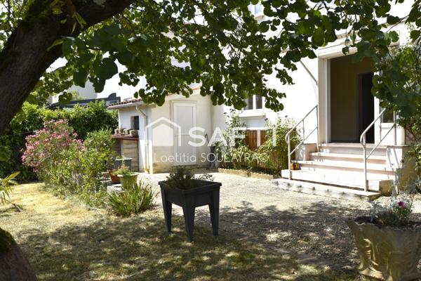 Maison 81 m² avec garage et jardin, proche centre.