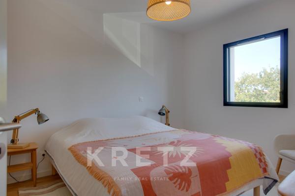 A deux pas des cinq cantons, élegant appartement en rez-de-jardin avec garage, cave et ascenseur