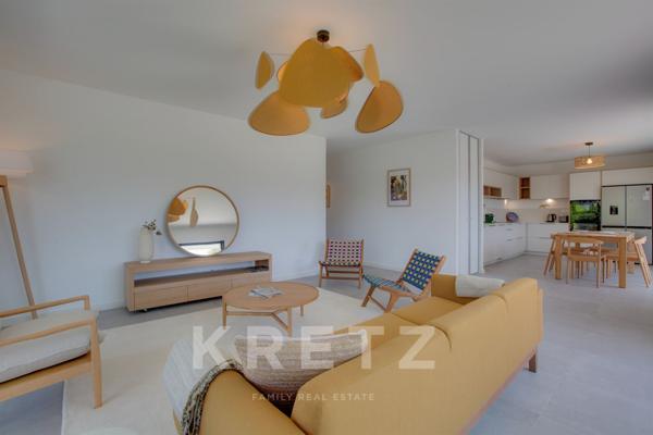 A deux pas des cinq cantons, élegant appartement en rez-de-jardin avec garage, cave et ascenseur