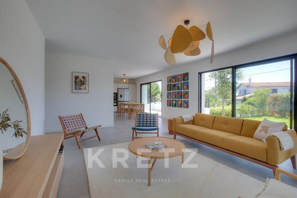 A deux pas des cinq cantons, élegant appartement en rez-de-jardin avec garage, cave et ascenseur