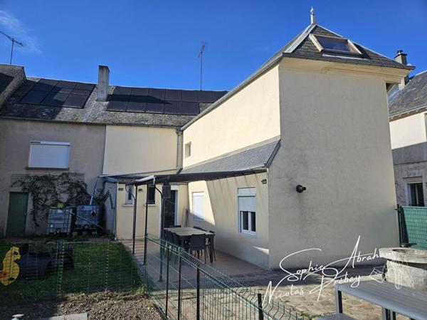 Maison en centre ville avec jardin, terrasse et places de parkings privatives