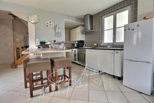 Maison en centre ville avec jardin, terrasse et places de parkings privatives
