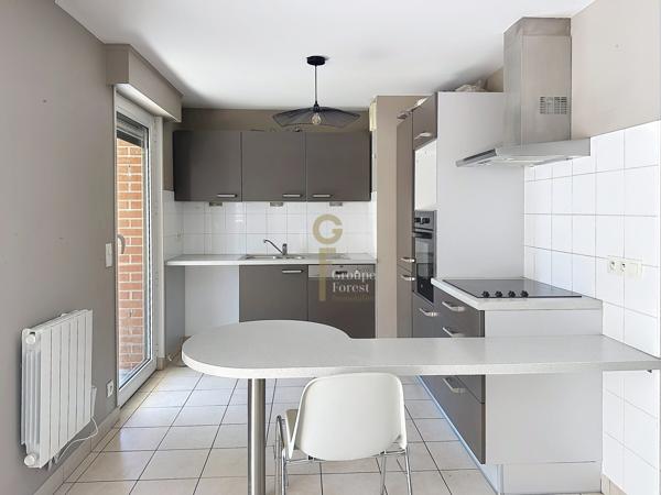 T3 DE 75M2 : 2 CHAMBRES, TERRASSE DE 20M2 ET PARKING